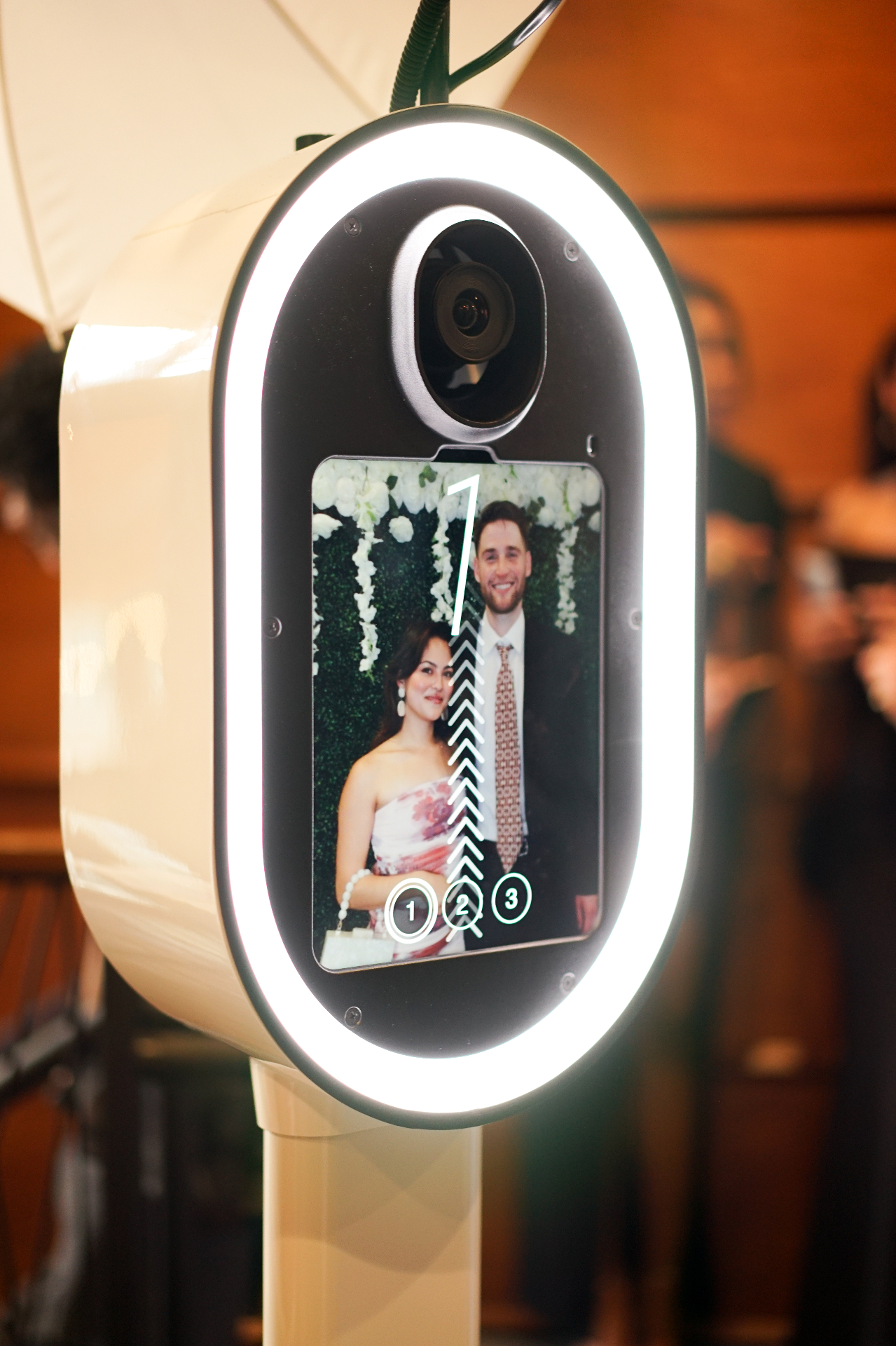 Close-up of the Palm Tree Photo Booth touchscreen guiding guests through their session